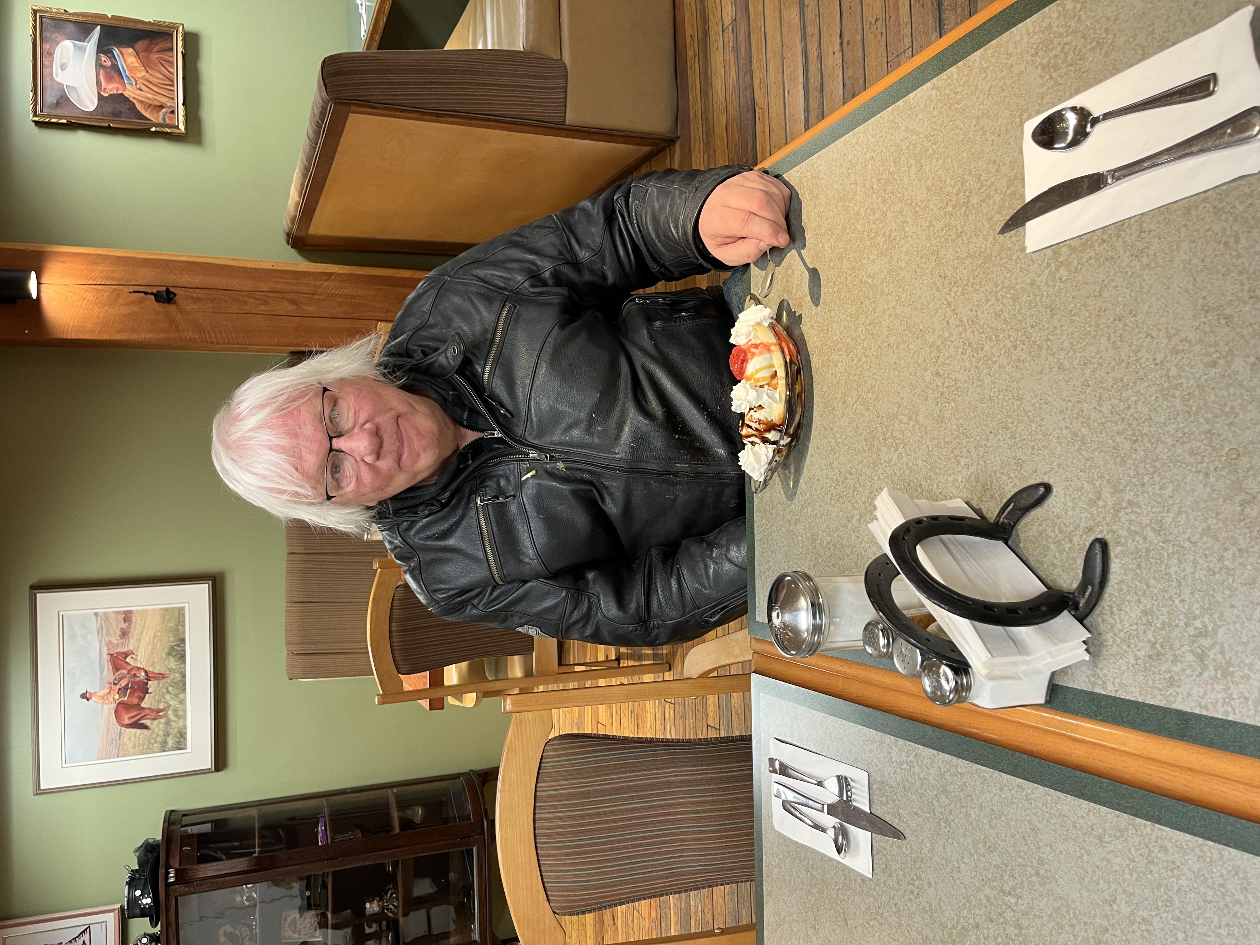 Happy customer enjoying homemade desserts at the table