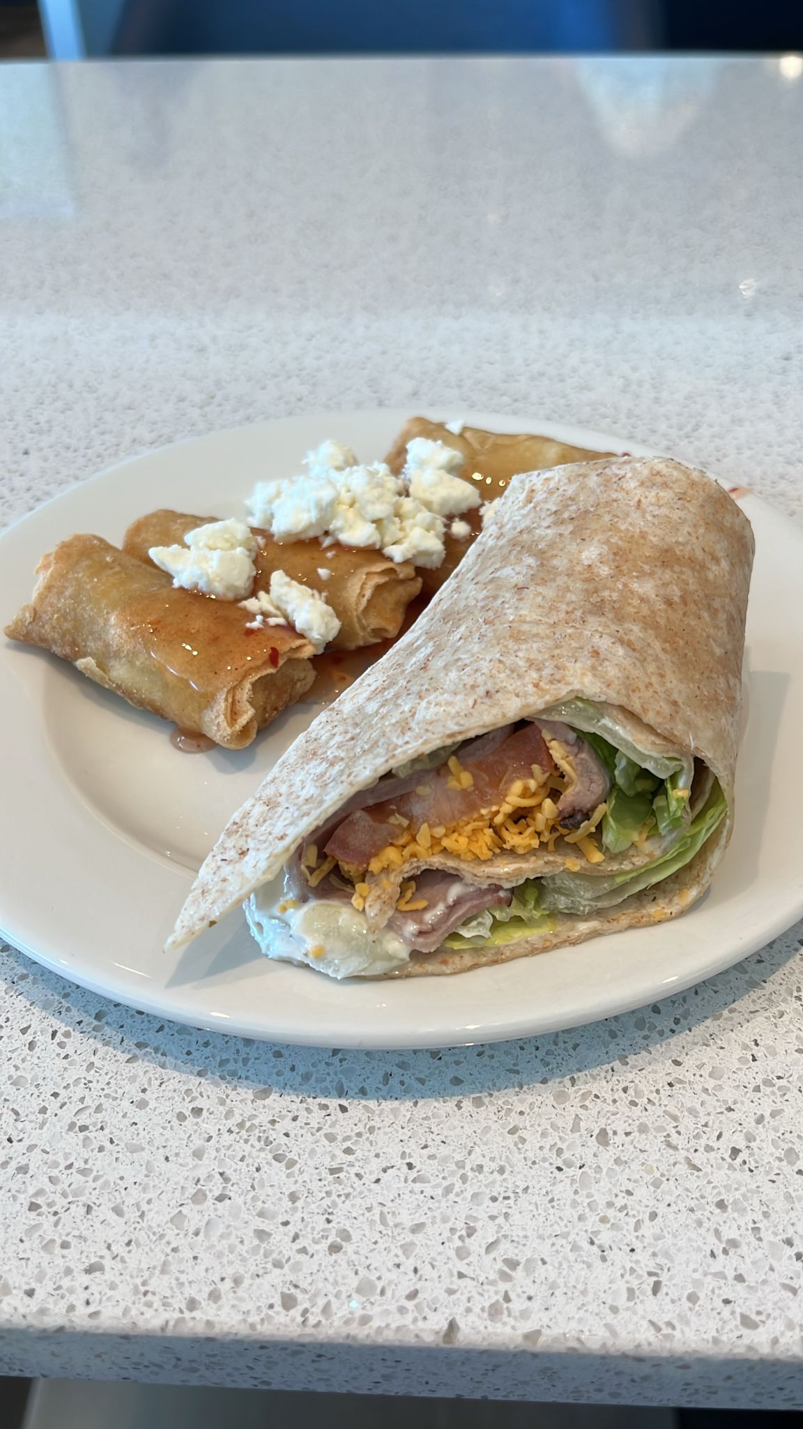 Wheat wrap with crispy flautas and taquitos