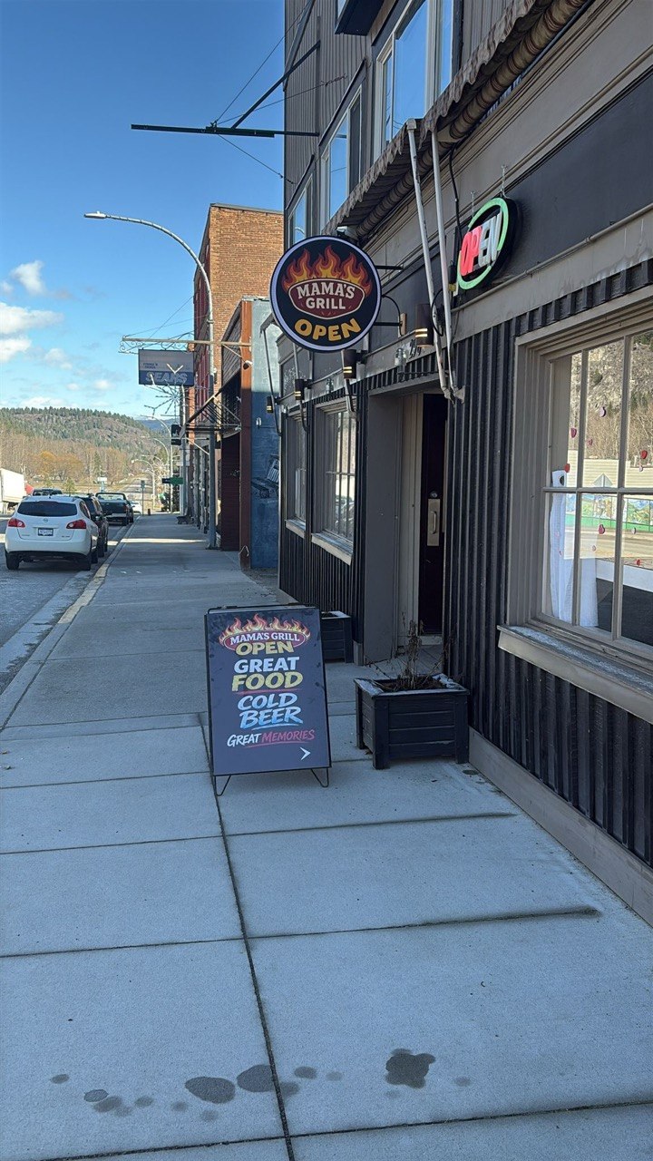 Mama's Grill storefront on Copper Avenue with mountains in the background, Greenwood BC